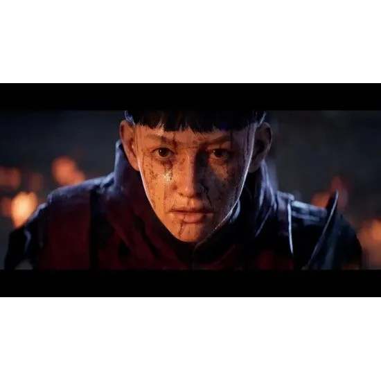 A premium golden game box alongside a physical artbook, a letter, and a fabric sew-on patch