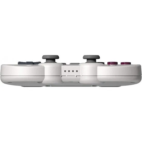 A retro-styled grey controller with purple face buttons and dual analogue sticks, inspired by classic 8-bit handheld aesthetics