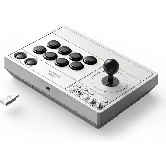 A sturdy white and black arcade fight stick featuring a ball-top joystick and large arcade-style buttons
