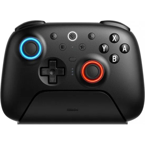 A premium black wireless controller with an RGB ring around the joysticks, sitting on a matching black charging dock