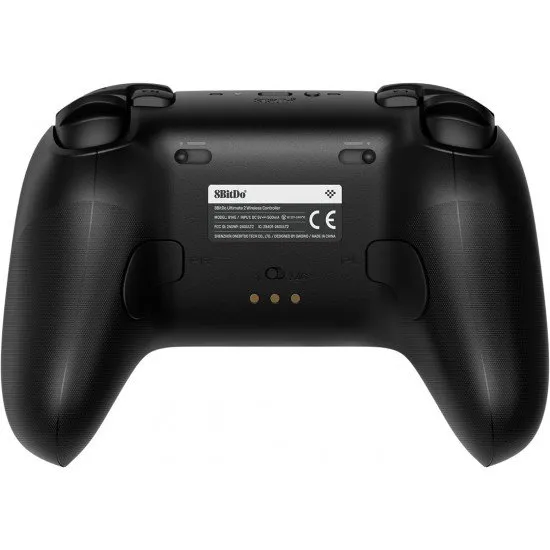A sleek wireless gaming controller sitting on its dedicated charging dock with visible back paddles and textured grips
