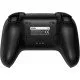 A sleek wireless gaming controller sitting on its dedicated charging dock with visible back paddles and textured grips