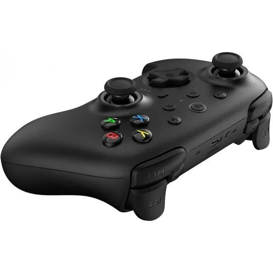 A sleek wireless gaming controller sitting on its dedicated charging dock with visible back paddles and textured grips