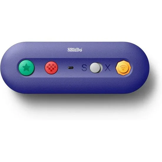 A small purple wireless adapter with ports for GameCube and Wii Classic controllers next to a Nintendo Switch console