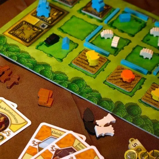Agricola board game box art showing a rural farming scene with wooden playing pieces