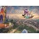 The box art for the Disney Aladdin 1000-piece puzzle by Thomas Kinkade, showing Aladdin and Jasmine on the magic carpet over Agrabah at sunset in the "Painter of Light" style.