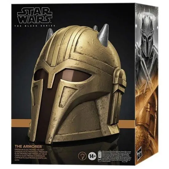 A life-sized gold-toned Mandalorian helmet with a spiked crown and dark visor as seen in the Disney plus series