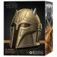 A life-sized gold-toned Mandalorian helmet with a spiked crown and dark visor as seen in the Disney plus series
