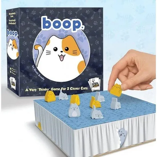 The box art for the boop. abstract strategy game, showing a bed playing surface with wooden cat and kitten pieces, with the title in a playful, stylized font.