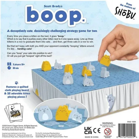 The box art for the boop. abstract strategy game, showing a bed playing surface with wooden cat and kitten pieces, with the title in a playful, stylized font.