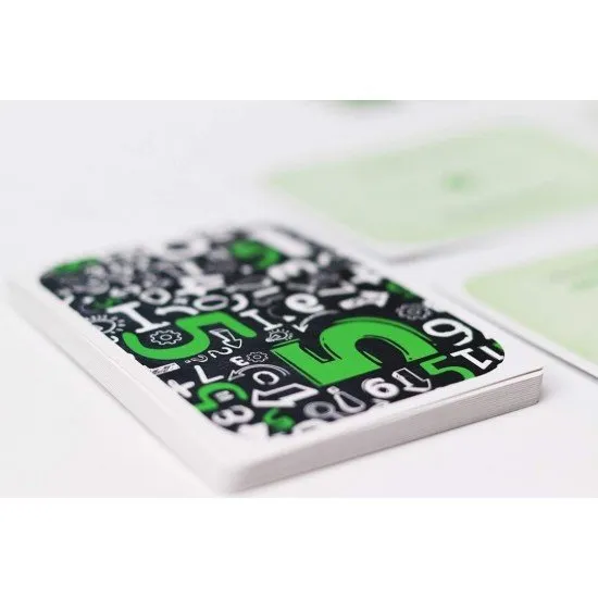 Colourful number tiles arranged behind a player shield with question cards on the table