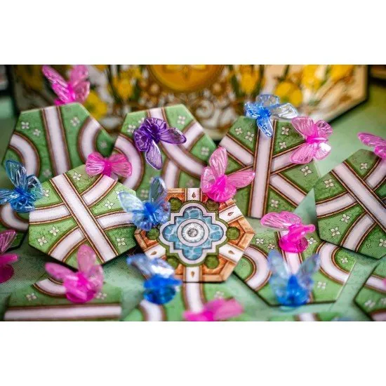 A collection of cards featuring detailed illustrations of various butterflies in a garden setting