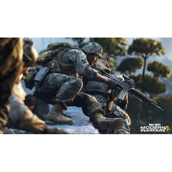 A PlayStation 5 game case depicting a modern tactical soldier in full combat gear standing amidst the smoky, war-torn ruins of a metropolitan city street