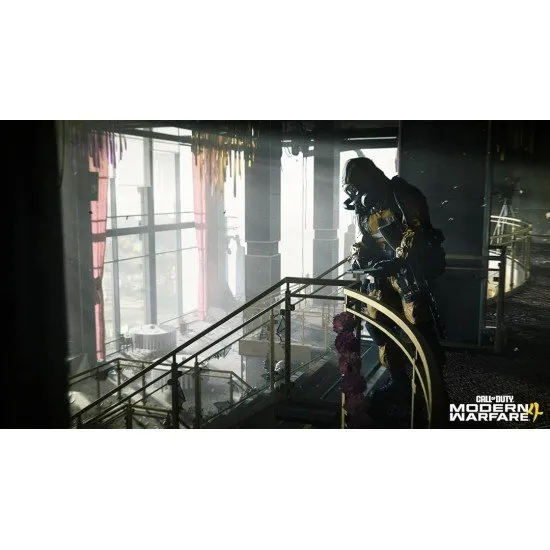A PlayStation 5 game case depicting a modern tactical soldier in full combat gear standing amidst the smoky, war-torn ruins of a metropolitan city street