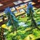 Canopy Evergreen board game box featuring lush Pacific Northwest forest artwork with trees and woodland creatures