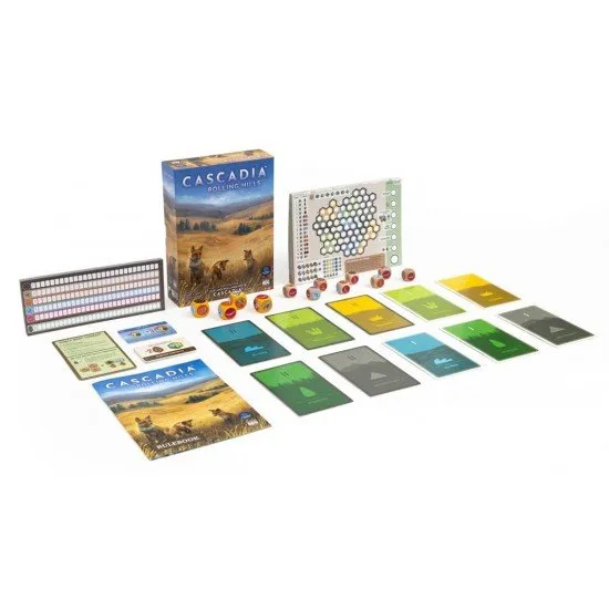 Colourful dice featuring animal icons alongside illustrated habitat sheets and cards depicting the rolling hills of Cascadia