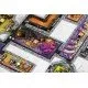 A collection of colourful new room tiles, moat pieces, and swan tokens spread out for the Castles of Mad King Ludwig board game