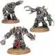Three heavily mutated Chaos Space Marine Mutilators clad in twisted Terminator armour with arms morphing into massive power claws and spiked maces