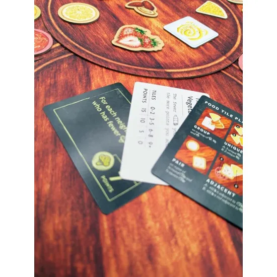 Charcuterie: The Board Game featuring food tiles and strategic charcuterie board building for 2-6 players