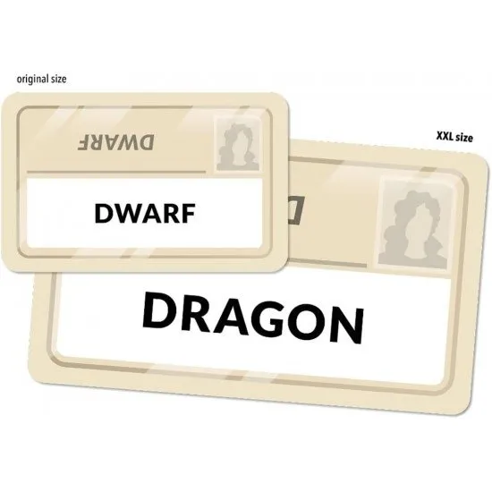 A tabletop layout showing oversized word cards in a 5x5 grid with a spymaster key card