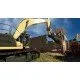 A high-power yellow excavator working on a large-scale construction site with a sprawling city skyline in the distance