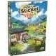 Cozy Stickerville board game box showing a vibrant village landscape and various colourful stickers