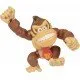 A highly detailed plastic action figure of Donkey Kong smiling and flexing his muscles inside a red and white Nintendo-themed window box packaging