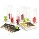 A collection of bright plastic test tubes filled with colourful balls arranged next to a deck of scientific formula cards on a white table