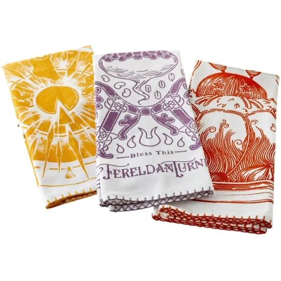 Dragon Age Kitchen Towels 3-Pack officially licensed flat lay showing three illustrated towels in gold purple and red Dragon Age artwork