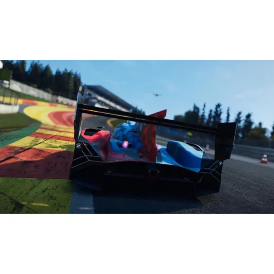 An Xbox Series X racing game case showing a high-speed Porsche Hypercar and a GT sports car tearing down a rain-slicked straight at Le Mans under dramatic skies