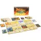 A board game expansion box showing a majestic fire spirit with glowing red eyes rising alongside a giant feathery bird spirit above a stormy sea