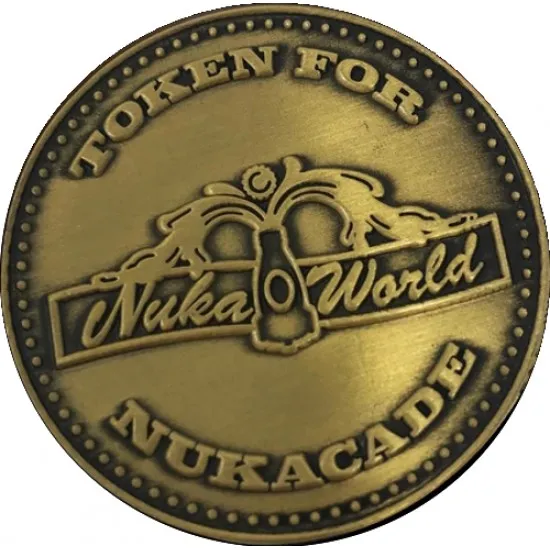 Metal Nuka-cade token replica with embossed lettering and star design