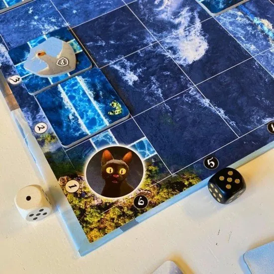 Flow board game box art showing animated animals (cat, companions) navigating water with floating tiles
