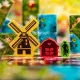 Box art for Frosted Blooms board game showing vibrant tulip fields and windmills under a soft spring sky