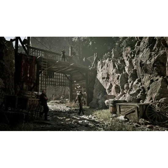 A protagonist standing on a cliff edge overlooking a vast mining camp with medieval structures