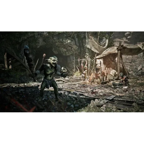 A protagonist standing on a cliff edge overlooking a vast mining camp with medieval structures