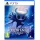 A PlayStation 5 game case showing the iconic small Knight holding a nail weapon under a glowing blue cavern background with crumbling ancient ruins