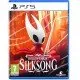 A PlayStation 5 game case showcasing a detailed fantasy setting with Hornet standing victoriously atop a ruined bell tower under a dramatic, crimson-lit sky