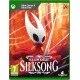 An Xbox game case featuring striking crimson artwork of Hornet wielding her needle weapon amidst glowing silk threads and dark, mossy stone caverns