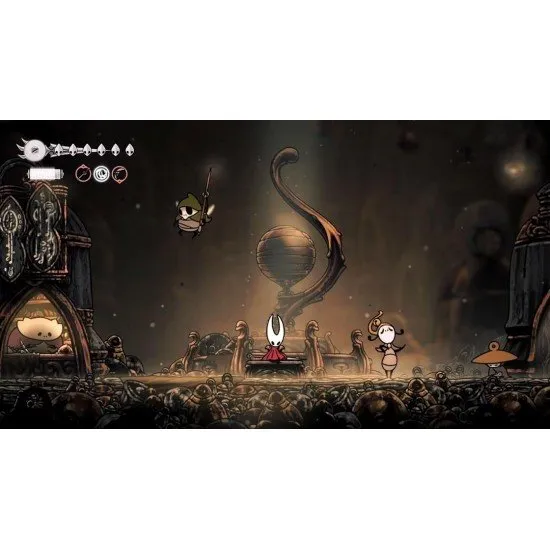A PlayStation 5 game case showcasing a detailed fantasy setting with Hornet standing victoriously atop a ruined bell tower under a dramatic, crimson-lit sky