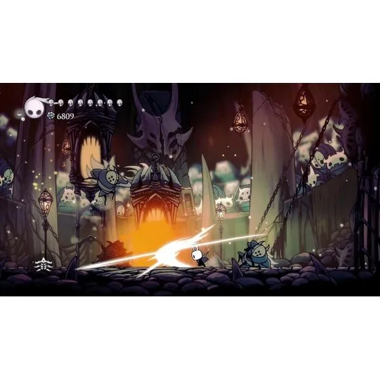 A PlayStation 5 game case showing the iconic small Knight holding a nail weapon under a glowing blue cavern background with crumbling ancient ruins