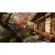 A Nintendo Switch 2 game case showing a modern suburban house alongside a serene Japanese garden filled with blooming pink cherry blossom trees
