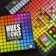 The box art for the Hues and Cues board game, featuring a colorful grid of hues with game pieces on it.