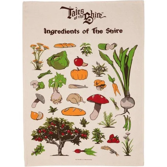 A cream-coloured tea towel featuring botanical illustrations of Shire herbs, fruits, and vegetables with artistic script