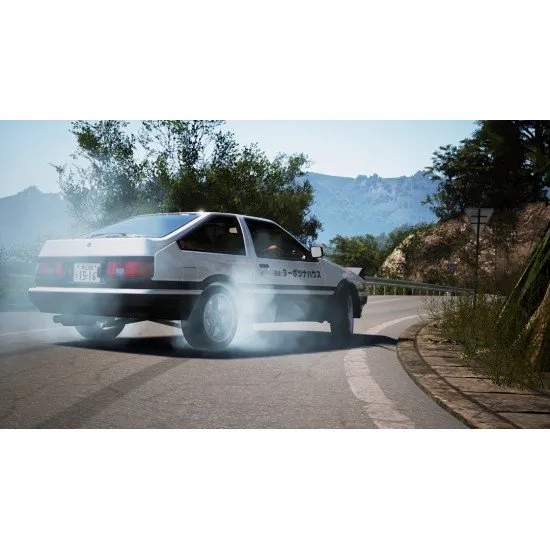 A PlayStation 5 game case showing a highly modified Japanese sports car drifting sideways around a sharp mountain hairpin bend surrounded by pink cherry blossom trees