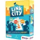 A colourful party board game box showing illustrated town squares, roads, and building tiles connecting together to form a vibrant, quirky city layout