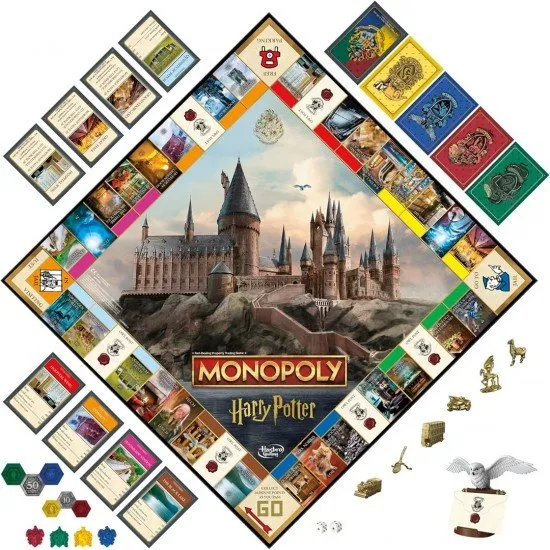 The box art for Monopoly - Harry Potter Edition, showing a game board with Hogwarts Castle in the center and golden tokens in the foreground.