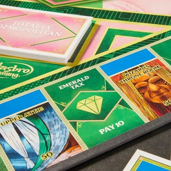 The box art for the Monopoly Wicked Edition board game, featuring characters from the film and custom golden game tokens.