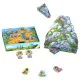 Paleolino cooperative children's board game featuring a 3D mountain, resource chips and prehistoric village building