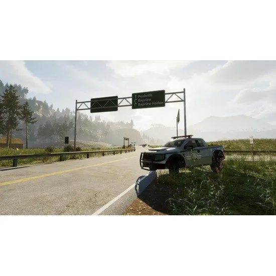 A park ranger vehicle parked near a dense forest with a helicopter flying over a lake